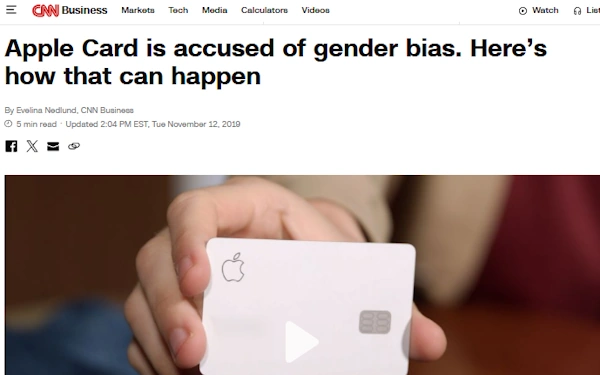 This image is a screenshot of a CNN Business article titled "Apple Card is accused of gender bias. Here’s how that can happen." The byline credits Evelina Nedlund from CNN Business, with the article dated November 12, 2019. The featured image shows a close-up of a hand holding an Apple Card, a sleek white credit card with the Apple logo and embedded chip. The headline suggests concerns over algorithmic or systemic bias in Apple Card’s credit limit assignments, raising issues around fairness and discrimination in financial technology.